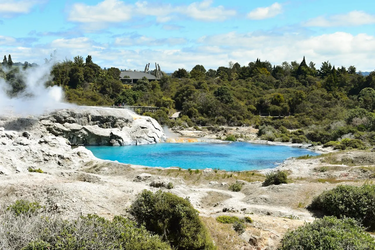 The geothermal Rotorua Lake with steam rising in New Zealand